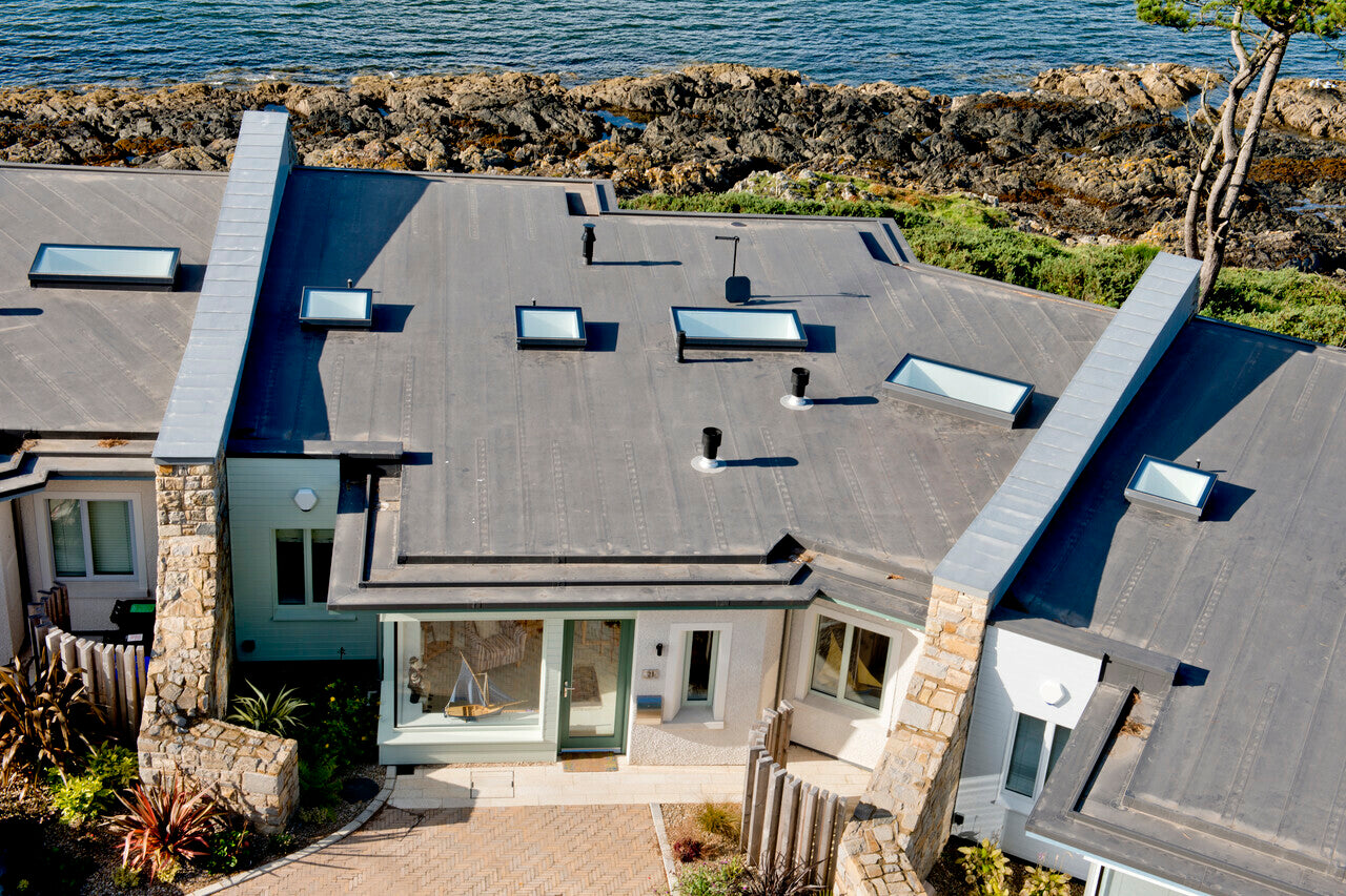 rooflights installed on flat roofs of neighboring houses by the sea