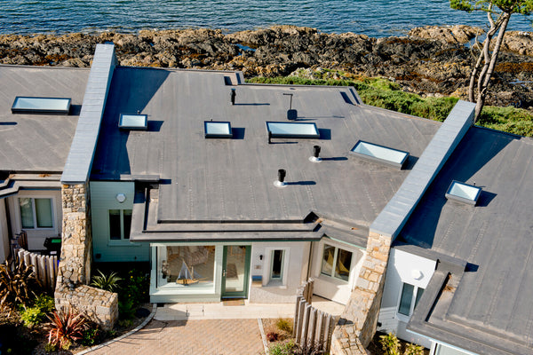 rooflights installed on flat roofs of neighboring houses by the sea