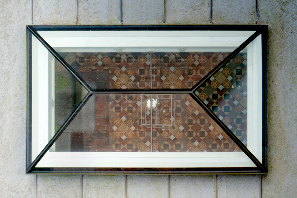 roof lantern seen from above, showing a tiled floor underneath 