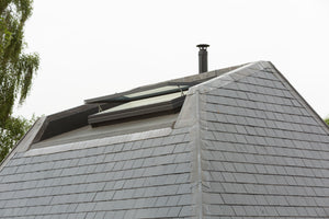 open rooflight on a tall tiled roof