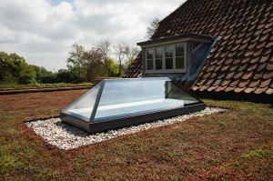 A pyramid rooflight (sometimes called a lantern rooflight) on top of a house.